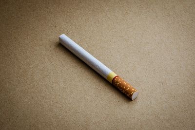 Close-up of cigarette on table