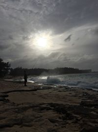 Scenic view of beach against sky during sunset