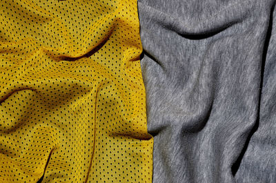 Close-up of crumpled yellow and gray textile