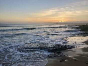 Scenic view of sea against sky during sunset