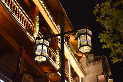 Low angle view of illuminated building at night