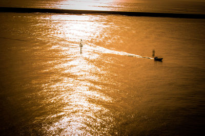 Scenic view of calm lake at sunset