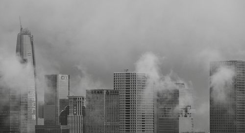 Modern buildings against sky in city