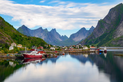 Scenic view of lake and mountains against sky