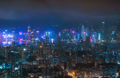 High angle view of illuminated city buildings at night