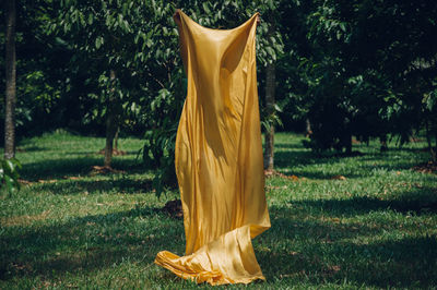 Yellow umbrella on field