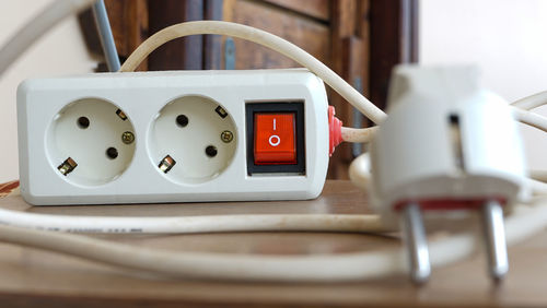 Close-up of telephone booth on table