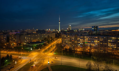 High angle view of city lit up at night