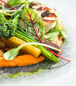 Close-up of fruits in plate on table