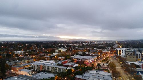 High angle view of illuminated cityscape against sky