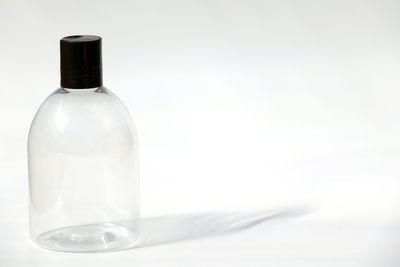 Close-up of wineglass against white background