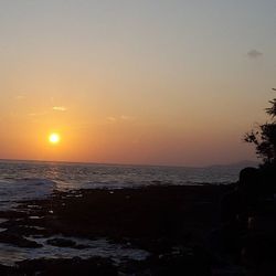 Scenic view of sea at sunset