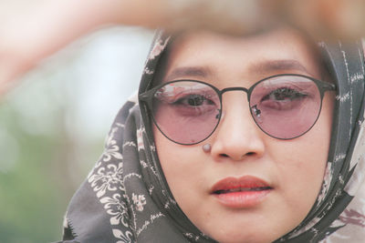 Portrait of young woman wearing sunglasses