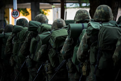 Rear view of soldiers in traditional clothing