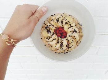 Cropped hand holding coffee