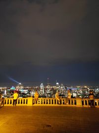Illuminated city buildings at night