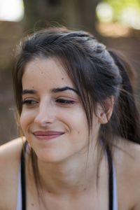 Close-up portrait of a smiling young woman