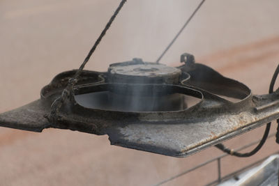 High angle view of metal structure on wood