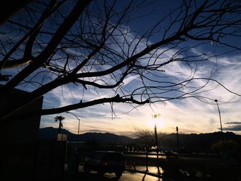 Cars on road at sunset