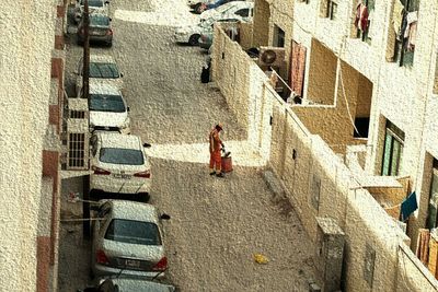 High angle view of woman walking on road