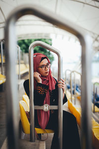 Woman standing by train