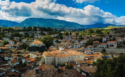 High angle view of town against cloudy sky