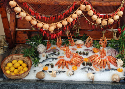 High angle view of frozen fish in container for sale at market