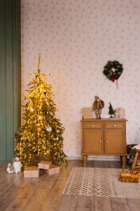 Children's room with a christmas tree and a scandinavian-style chest of drawers, decorated 