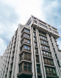 Low angle view of apartment building against sky