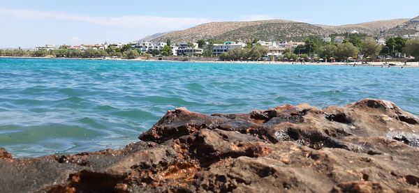 Scenic view of sea and buildings against sky