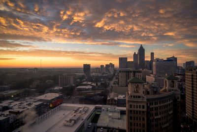 High angle view of buildings against sky during sunset