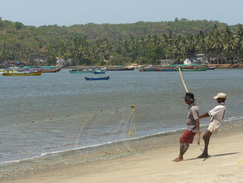 Full length of woman standing on shore