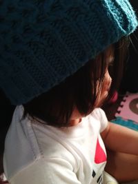 Close-up of girl sitting indoors