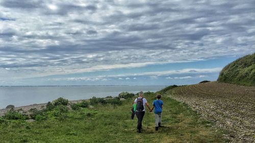 Scenic view of sea against cloudy sky