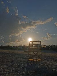 Scenic view of beach against sky during sunset