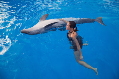 Full length of woman swimming in pool