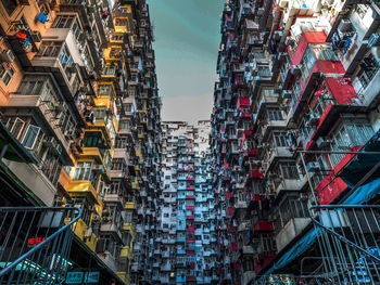 Low angle view of buildings against sky in city