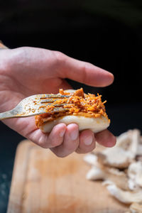 Close-up of hand holding food