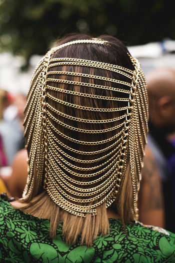 Rear view of woman wearing jewelry on head 