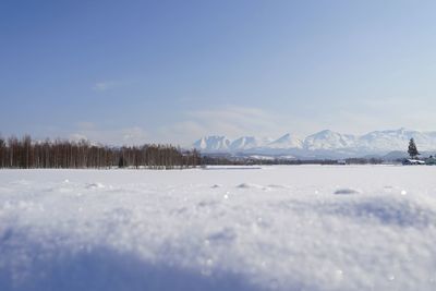 Scenic view of snow covered mountains against sky