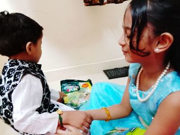 Siblings and woman in traditional clothing