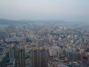 Aerial view of modern buildings in city against sky