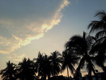 Low angle view of silhouette trees against sky at sunset