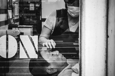 Man working on glass window