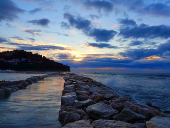 Scenic view of sea against sky at sunset