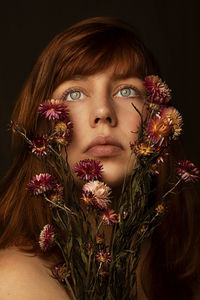 Close-up of woman with flowers