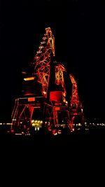 Low angle view of ferris wheel against sky