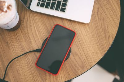 High angle view of mobile phone on table