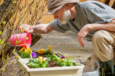 Senior man gardening in yard