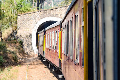 Kalka shimla toy train moving on mountain slopes, beautiful view, one side mountain, one side valley